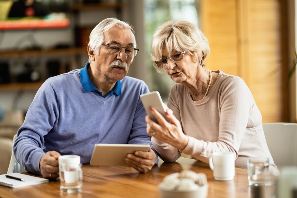 Older couple reaching out by phone. Social Connections for People Over Age 60
