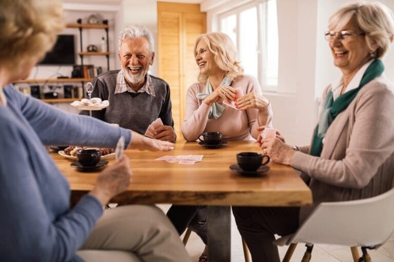 Older couples playing cards. Social Connections for People Over Age 60